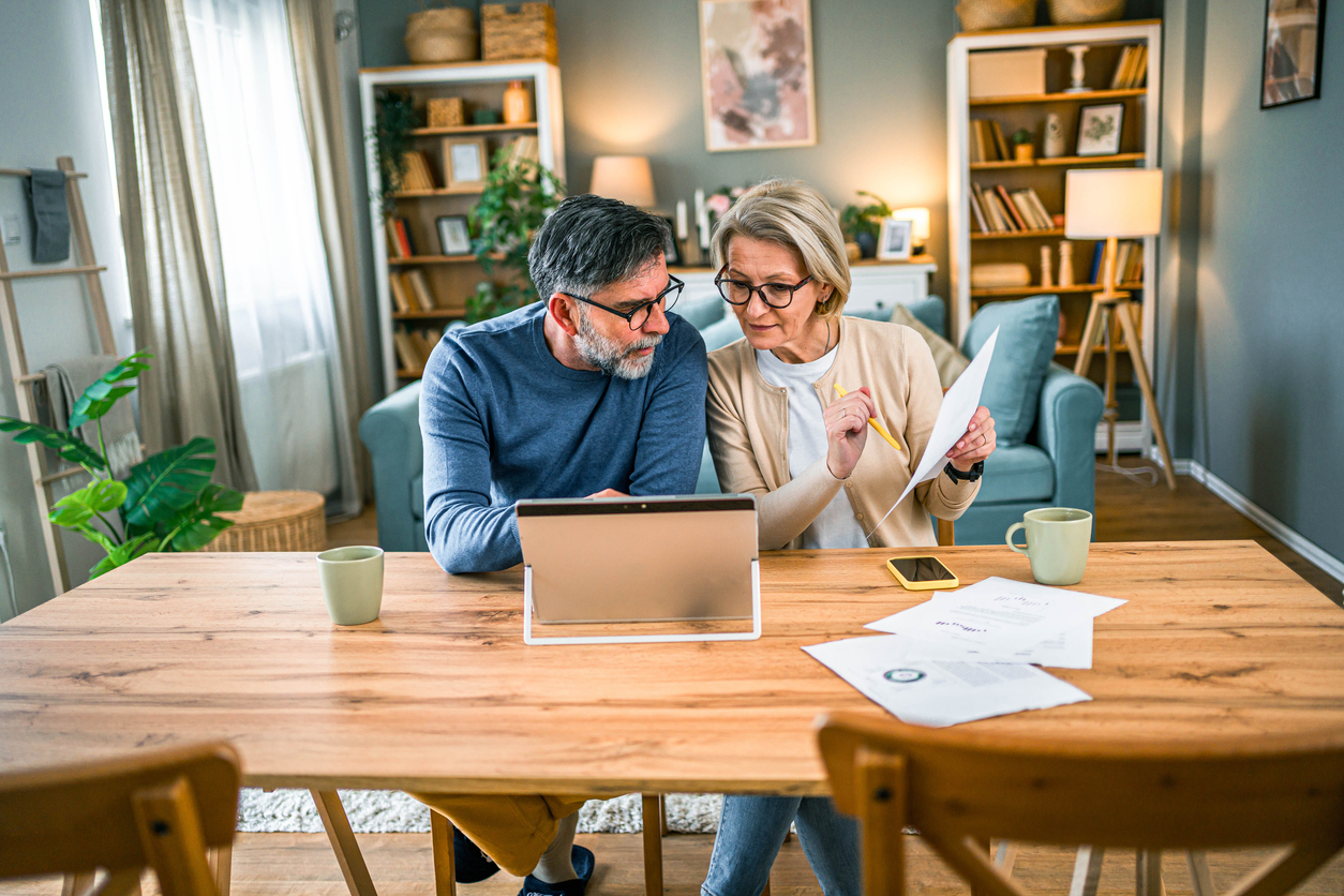 Mature couple managing home budget Canadian with an IRA